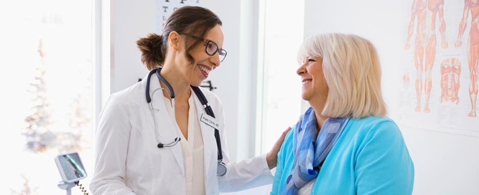 Doctor touching patients shoulder